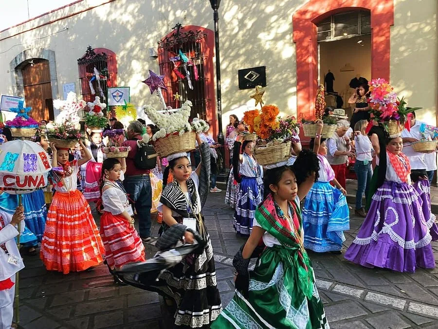 Culinary Heritage Unveiled: 4 Must-Try Delicacies in Oaxaca, Mexico 5 Oaxacan children march in a comparsa, wearing traditional dress